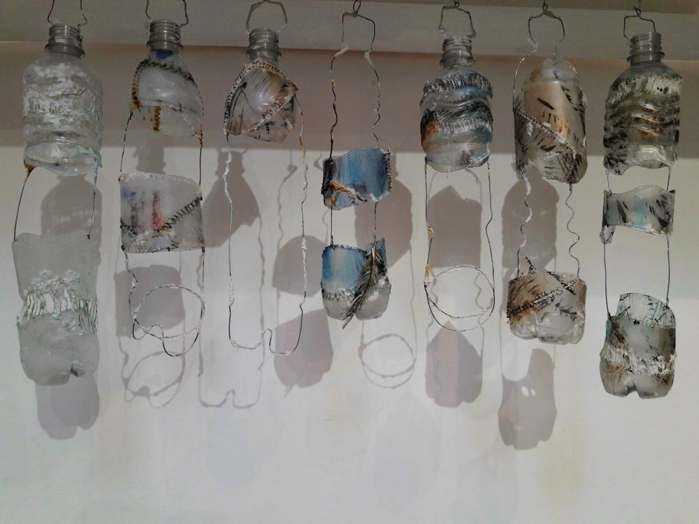 7 fragmented plastic bottles, restored in misshapen forms
